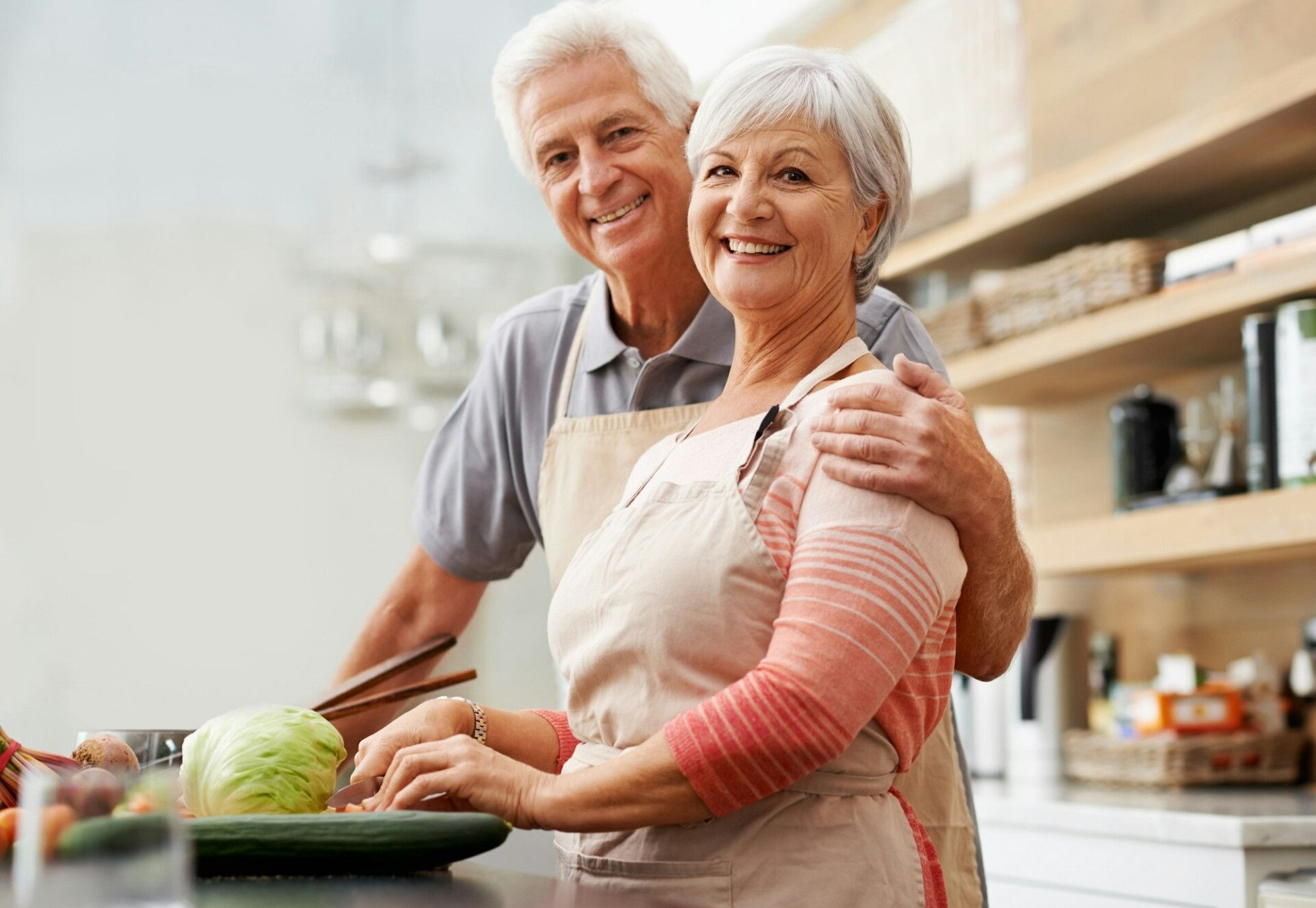 Shot of a happy husband and wife in their kitchen